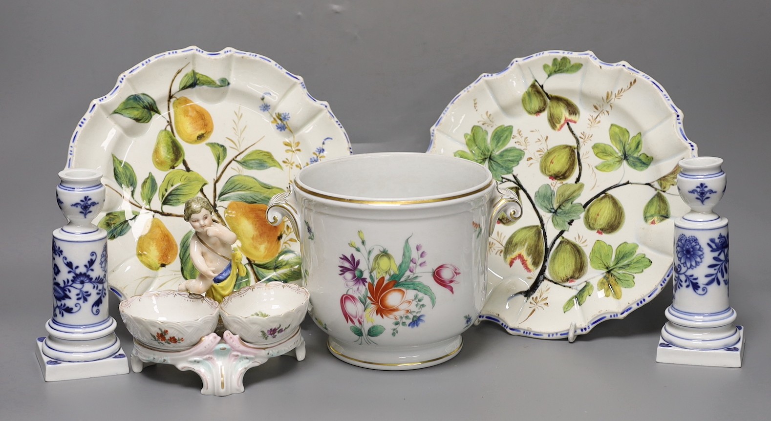 A pair of Meissen onion pattern candlesticks, 14 cm high, a Berlin figural salt, two Nove maiolica plates and a Richard Gingrich cache pot